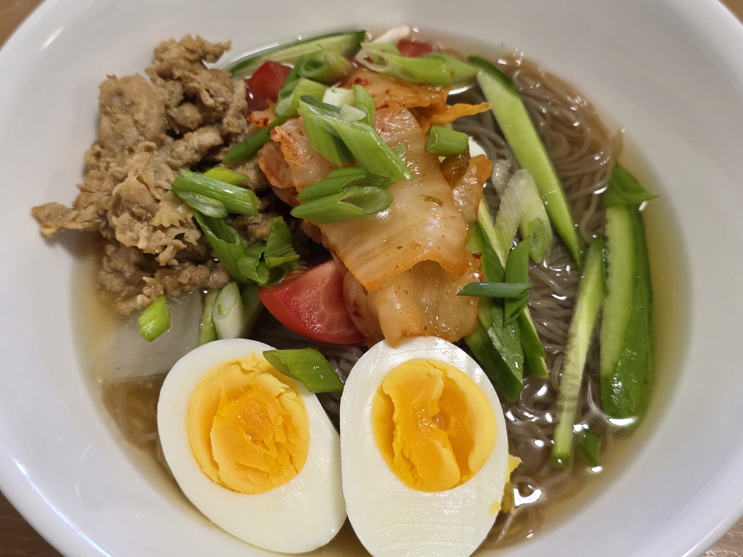 Cold Korean noodles served for lunch after returning from a family trip.